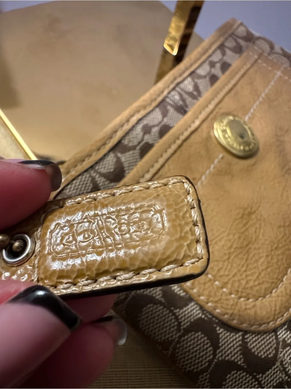 Coach Signature Mini Wristlet in Brown and Tan